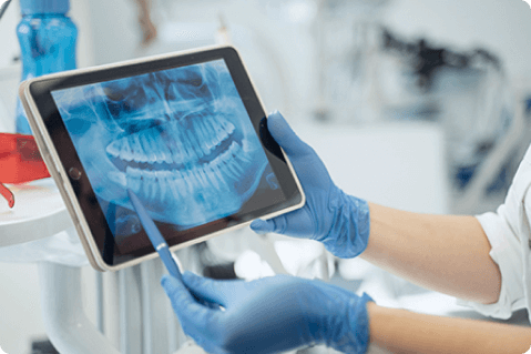 Dentist showing X-ray image to patient