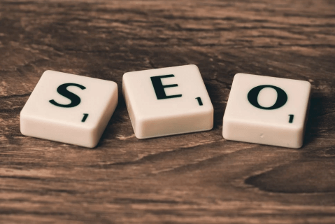 The word SEO written on wooden letter blocks,